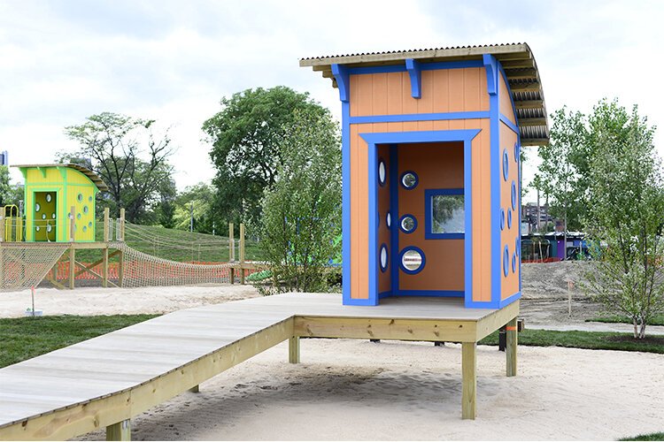 Colorful climbing lifeguard playscapes offer exploratory fun for kids on the beach. 