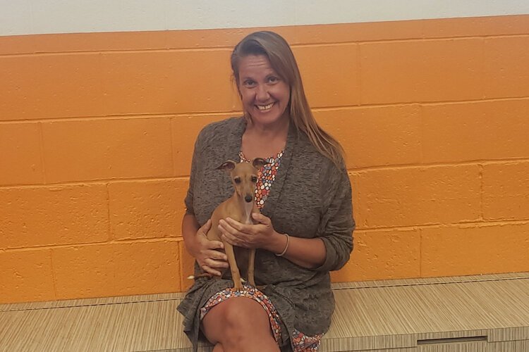 Canine to Five owner Liz Blondy with Tofu, a newcomer to the dog day care.