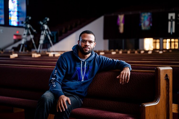 Dave Merritt sits on a pew at Straight Gate church.