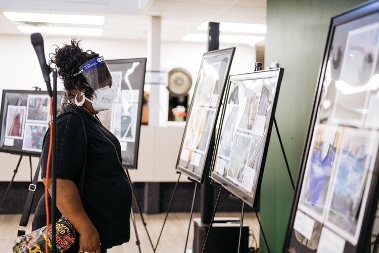 A visitor checks out photos at the Stoudamire center.