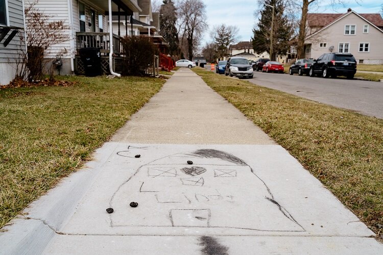 It's clear from this sidewalk drawing that somebody in Newberry really loves their home.