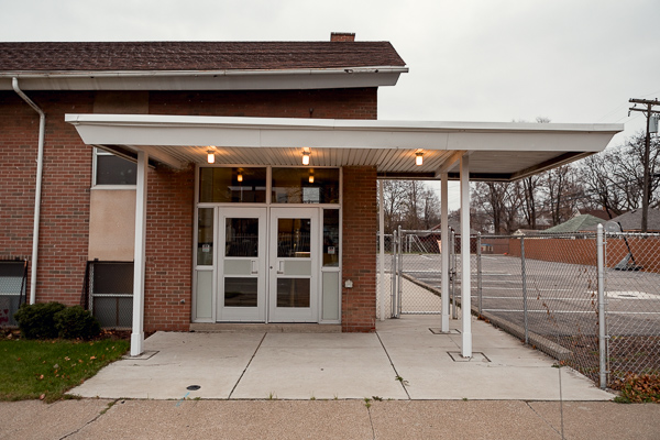 A canopy that needs to be adjusted to pitch in the direction of the greenery, not the parking lot