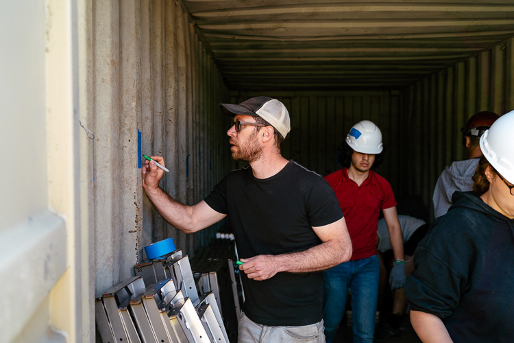 Raphael Zollinger organizes pieces for the riad's structure.