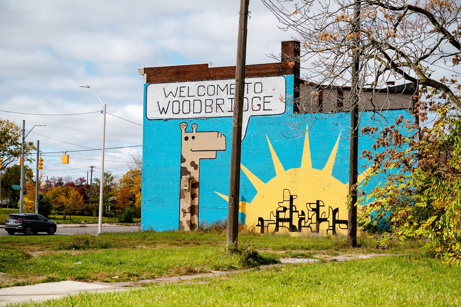 A colorful mural by Carl Oxley III welcomes people into Woodbridge.