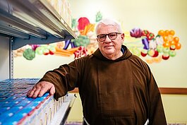 Br. Gary Wegner in the food pantry  at Capuchin Services Center.