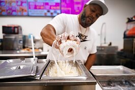 Mario Williams makes donuts at his E. Warren eatery.