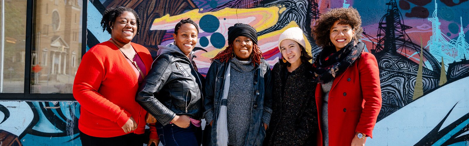 From Left, Raven Martin - Detroit Narrative Agency, Cornetta Lane-Smith - Detroit Narrative Agency, Nezaa Bandele - Paradise Natural Foods, Jenny Lee - LOVE Building, and Amanda Alexander - Detroit Justice Center, pose outside of the LOVE Building.