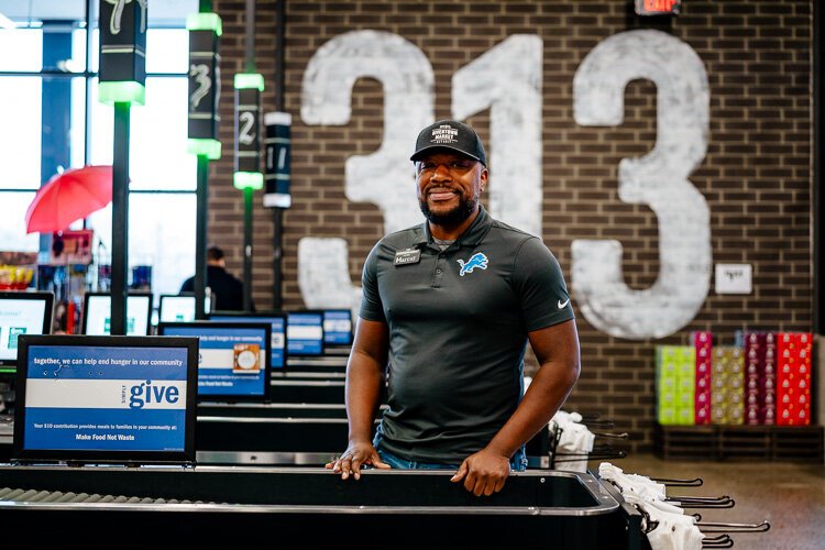 Marcus Reliford stands by the checkout lanes at Rivertown Market.