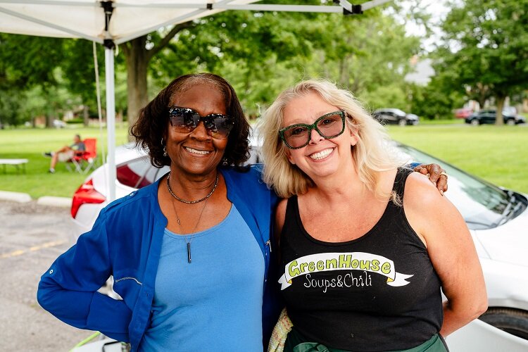 Food entrepreneurs Debra Griffin and Jane Bate share a prep kitchen at Focus Hope before setting up side-by-side at the Thursday market.