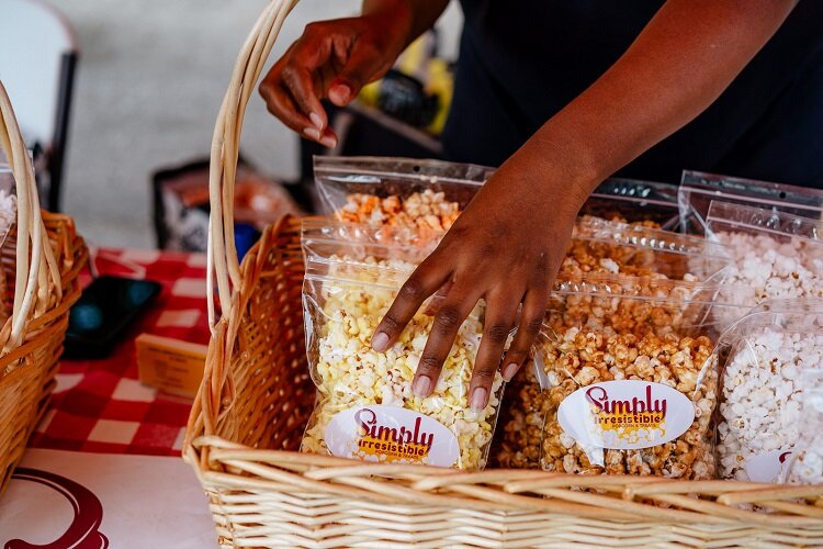 Last summer, Stephanie Philpot continued selling her flavored popcorn at market through curbside service. This family business has been in God's hands, she says today.