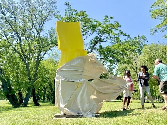 City officials and contributing artist unveil the newly restored "Ascension" sculpture to the public.