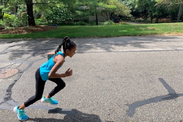 Rachel Korley sprints through her neighborhood.
