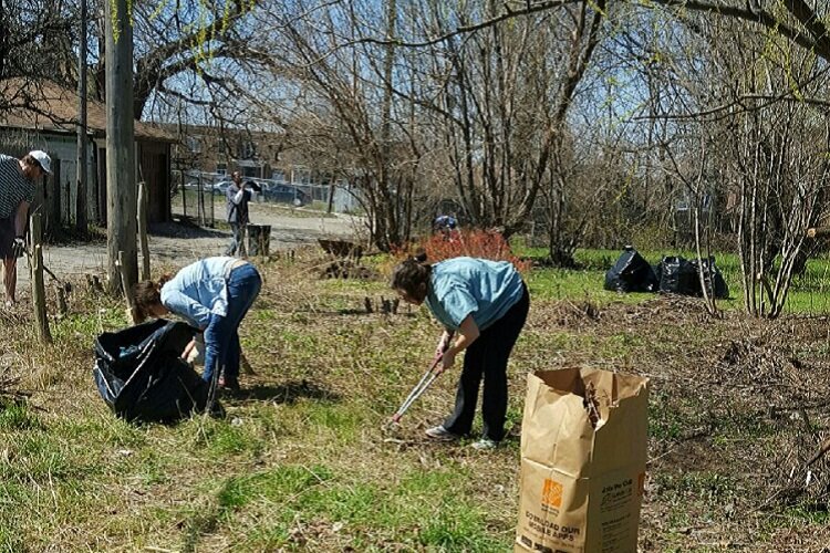 Residents involved with the Euclid Block Club help out with a community cleanup.
