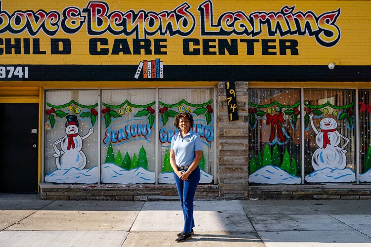 Above & Beyond Learning Center owner Nina Hodge poses in front of her business.