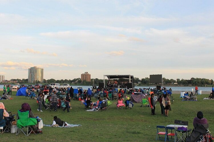 Parkgoers enjoy some music at West Riverside Park.