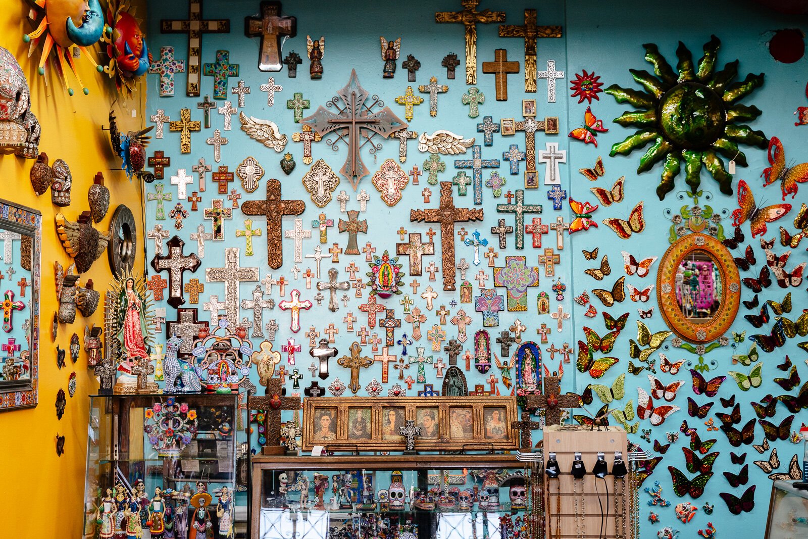 A wall of crosses and butterflies at Xochi's Gift Shop.