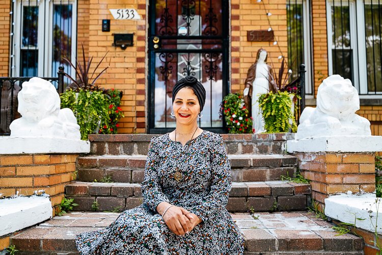 Fadiah Yahya sits in front of her SW Detroit home.