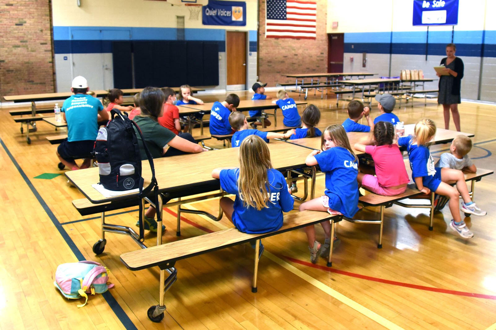 Campers at the YMCA summer day camp at Petoskey's Ottawa Elementary School snack on their formerly mystery fruits and vegetables.