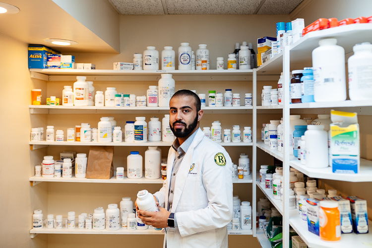 Wayne State University pharmacy student Abdullah Mattit volunteers at HUDA.