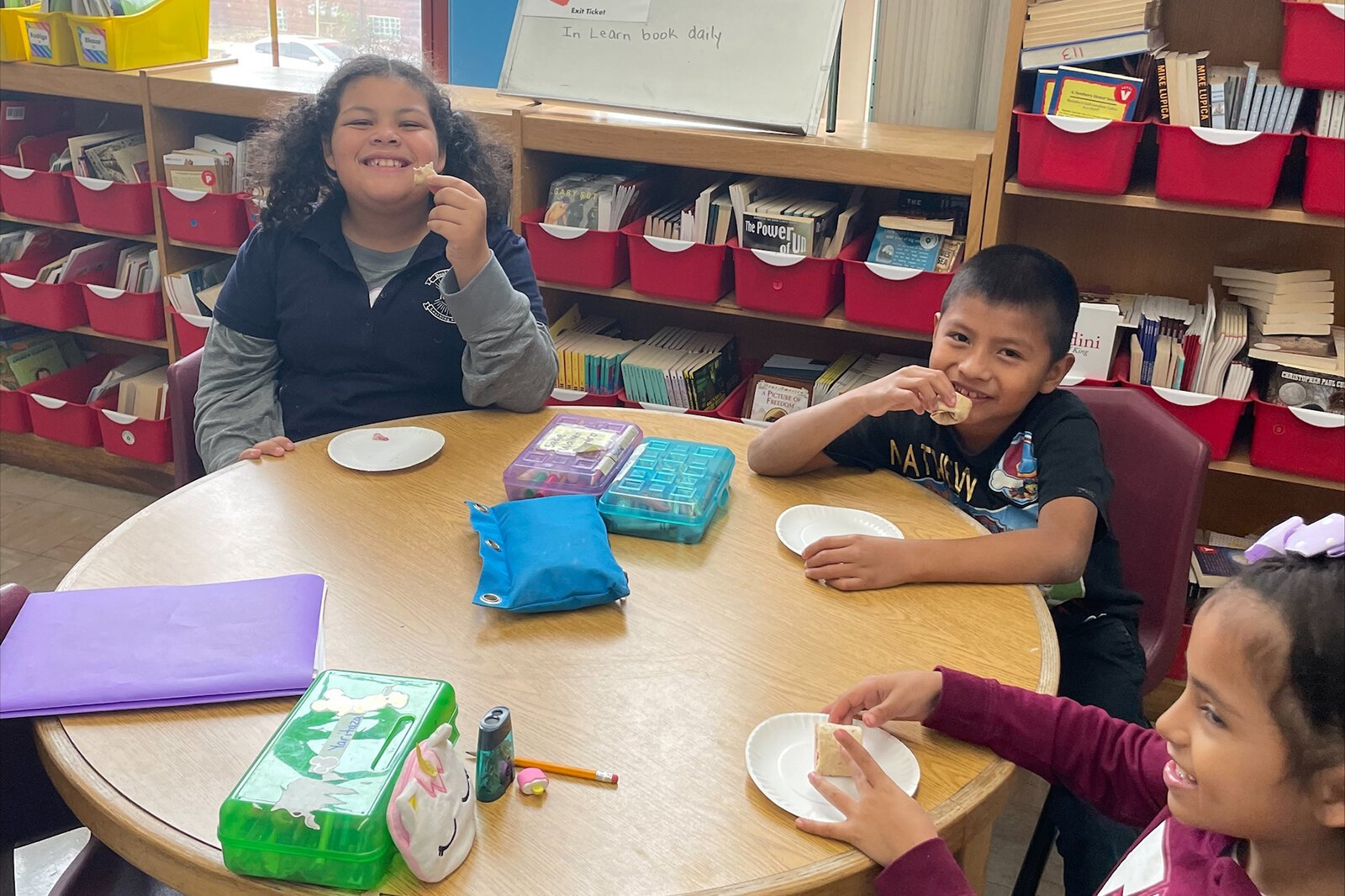 Third-grade students at Neinas Dual Language Learning Academy in Detroit trying a yummy fruity roll-up tasting.