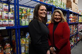Tina Swanton, Michigan Health Improvement Alliance (MiHIA) executive director of community impact and strategic partnerships, and MiHIA CEO Heidi Tracy at Hidden Harvest and East Side Soup Kitchen in Saginaw.