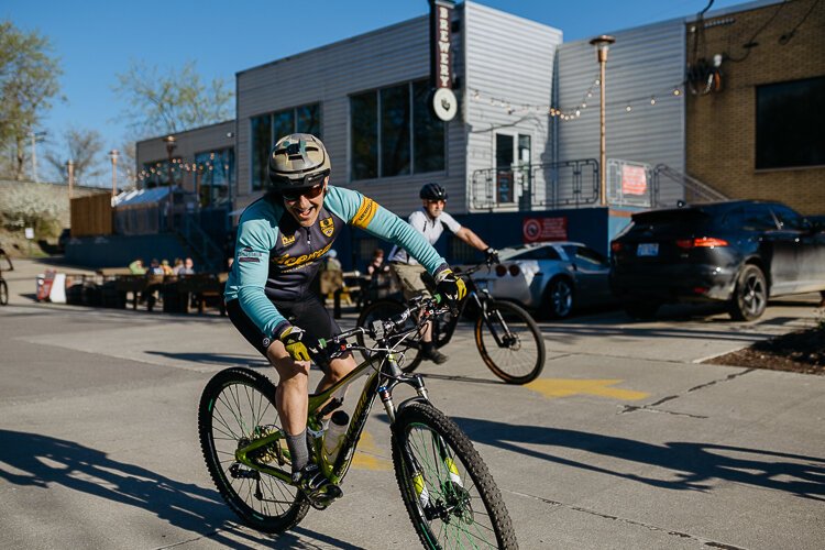 Members of the cycling group Spoke Junkies head off on their bi-weekly ride from River's Edge Brewing Company in Milford.