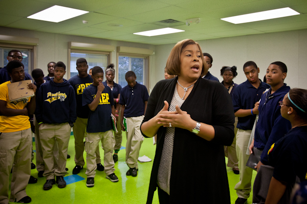 Kristin Woods, Plymouth Educational Center's 9th grade academy principal, gathers students for their daily morning Restorative Practice