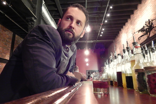 Michael Forsyth at the bar of Detroit City Distillery