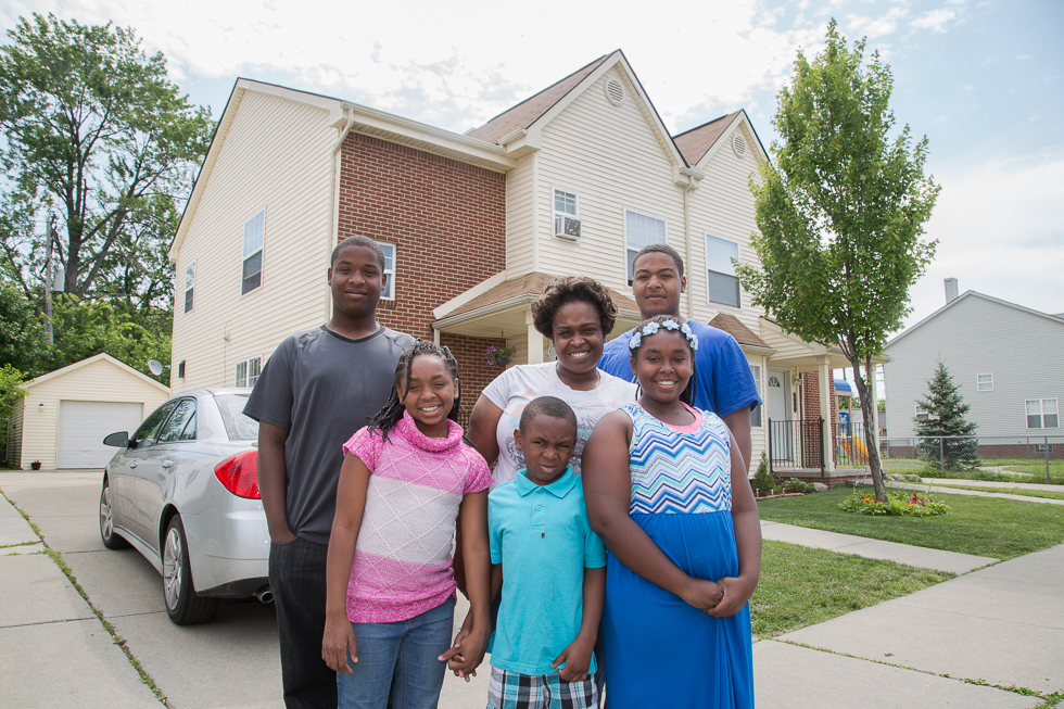 The Simms family in front of their home in Morningside