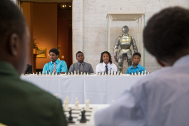 Young Detroit chess players wait to play Grandmaster Hikaru Nakamura 