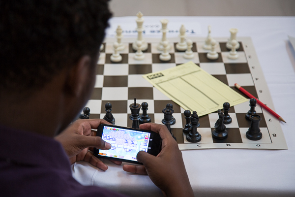 A Young Detroit chess player wait to play Grandmaster Hikaru Nakamura 