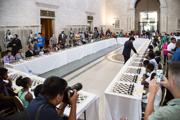Grandmaster Hikaru Nakamura takes on 50 Detroit-area chess players at once in the DIA's great hall