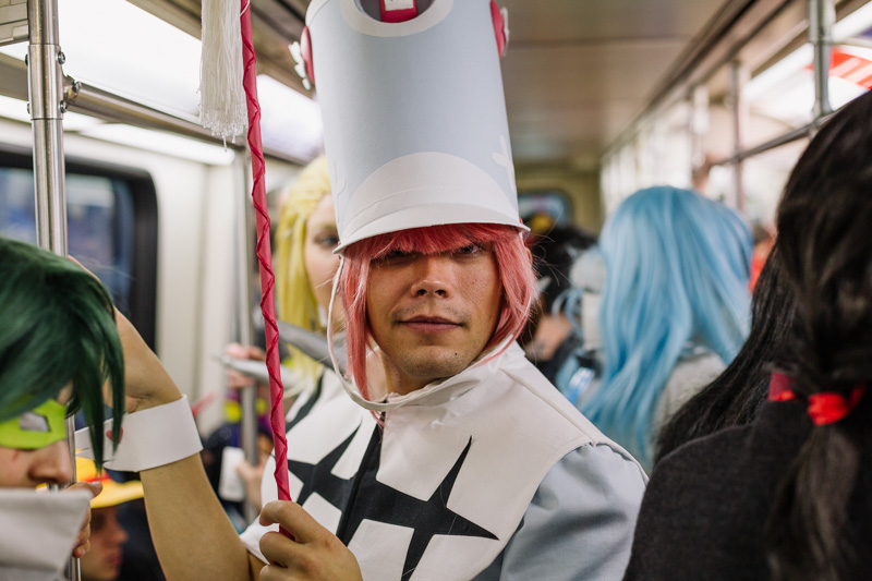 Youmacon attendees riding the People Mover