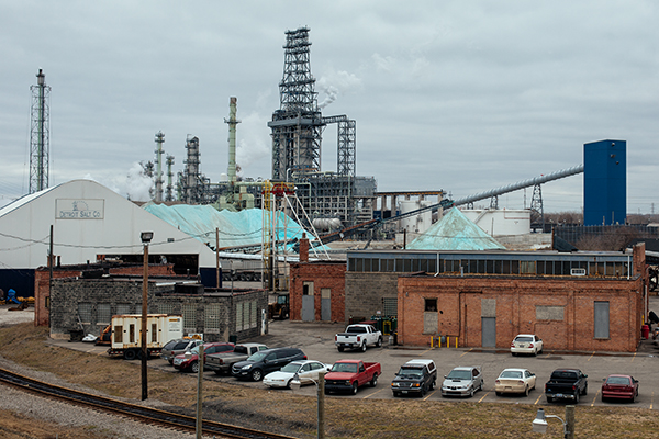 Piles of rock salt sitting in front of the shaft of the Detroit Salt Mine