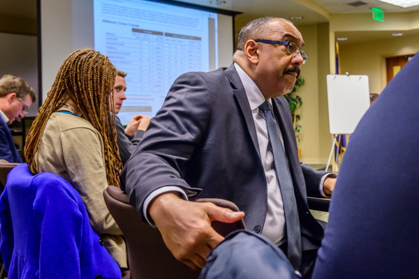 Chief Holt listens at a CompStat meeting