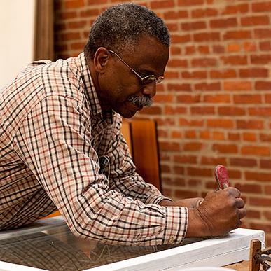 James A. Turner restoring a window to historic standards