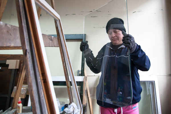 Guisa Suttle and Maria Fernandez glazzing and fitting glass at Turner Restoration's workshop