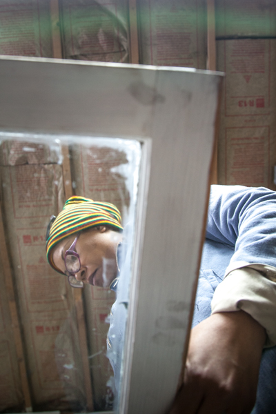 Guisa Suttle and Maria Fernandez glazzing and fitting glass at Turner Restoration's workshop