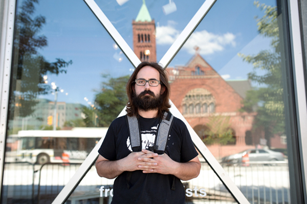 Artist Andy Thompson in front of the Detroit Artist Market