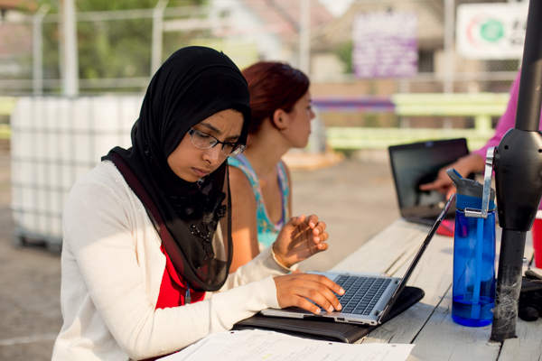 Nada Alhamdi entering data into her spreadsheet