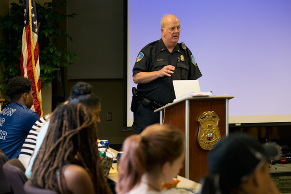 WSU police officer speaks to the students attending the workshop at the WSU Police Department