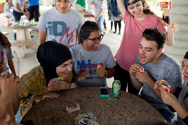 An intense game of Uno at the Peaceful Picnic held at Dingell Park in Ecorse