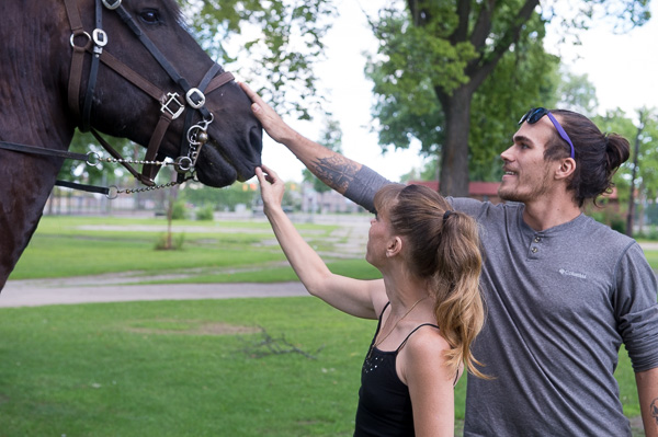 Theresa Snyder and Joseph Cox of Detroit pet Andre, a police horse