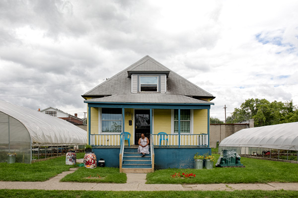 Jerry Hebron on the porch of her house at Oakland Avenue Urban Farm