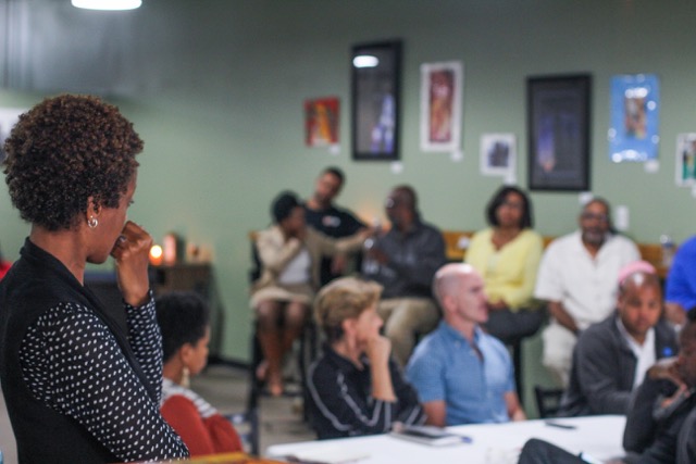 Live6 Aliance executive director Lauren Hood listens during the community meeting