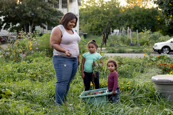 Erin Cole, co-owner of Nurturing Our Seeds, with her two children, Oshun and Asa