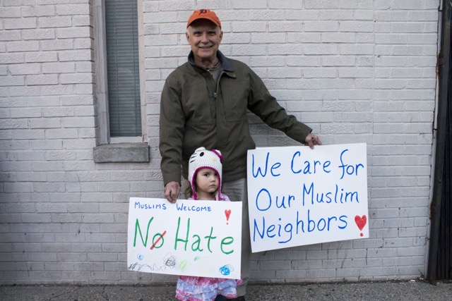 Man and child attending Hamtramck peace rally