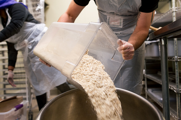 Jacob Schoenknecht, Small Batch Director, pours oats