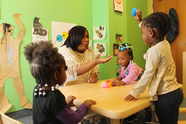 Angela Hayes, owner of Lil Brilliant Mindz, working with kids