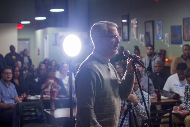 Audience member asks a question